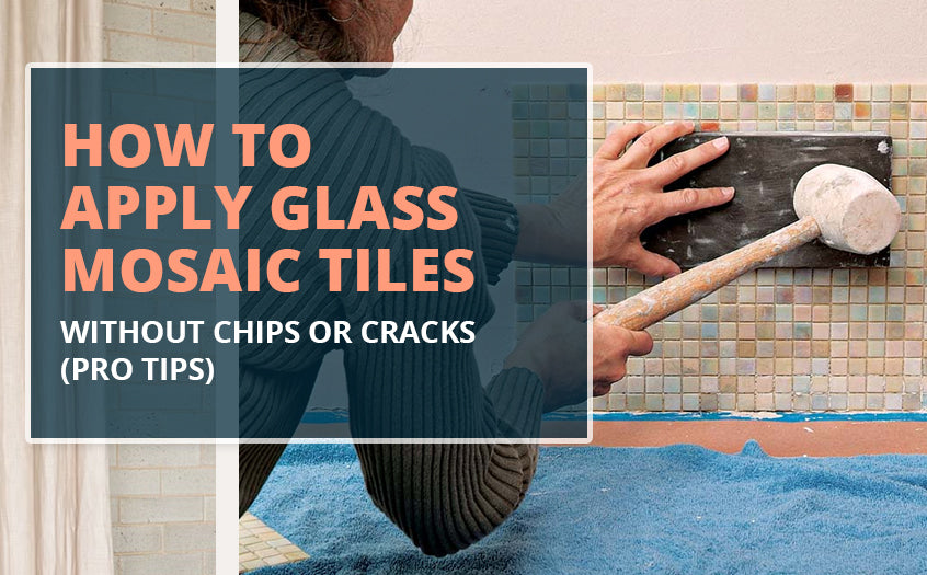 A person installing small square glass mosaic tiles on a wall using a rubber mallet and float, demonstrating careful tile application to prevent chips or cracks.