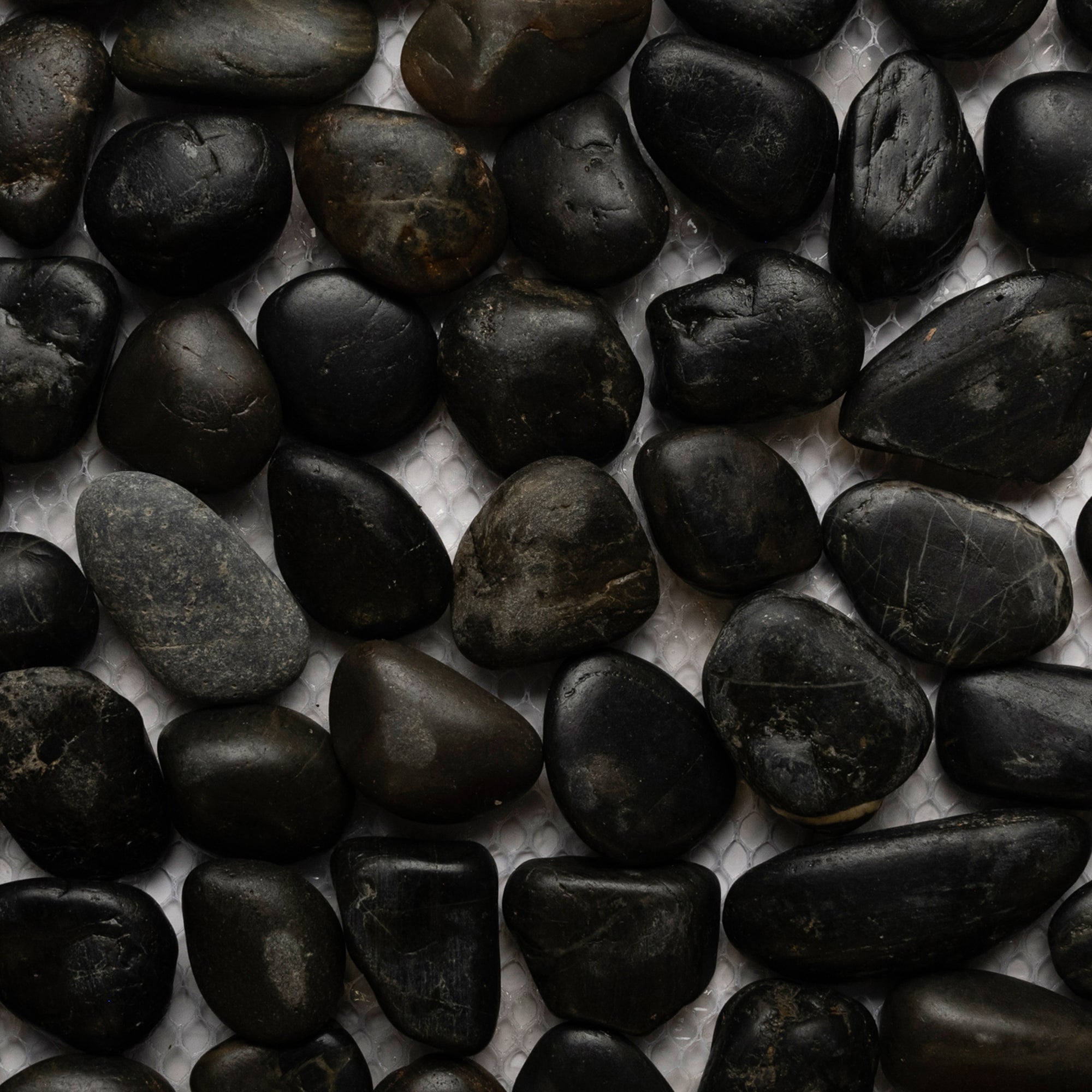 Luxurious Polished Black Pebble Tiles for Timeless Elegance